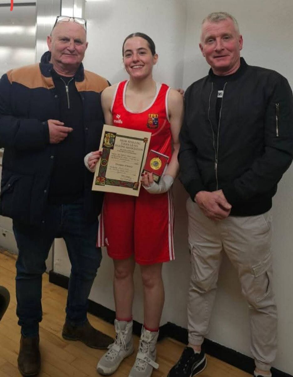 Spartan BC coaches Paddy McSweeney and Stephen Hartnett, with Hannah Zaidan, who won the All-Ireland Third Level Boxing Championships at the National Stadium in Dublin.