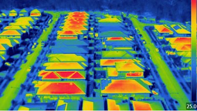 The urban heat island effect, seen through infrared imaging, shows the difference in temperatures black roofs make.