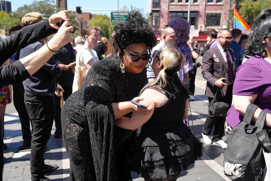 People line the streets to farewell drag star Maxi Shield.
