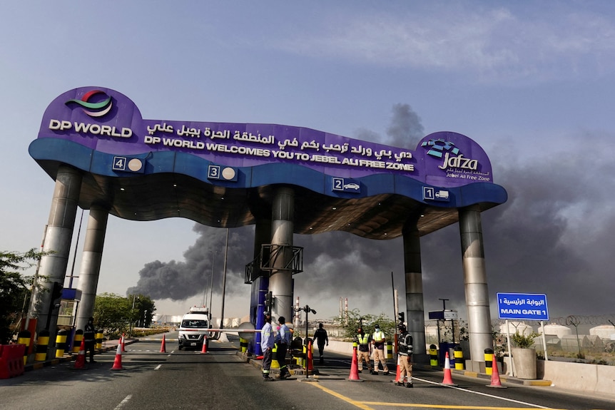 Smoke billows out of an airport in Dubai.