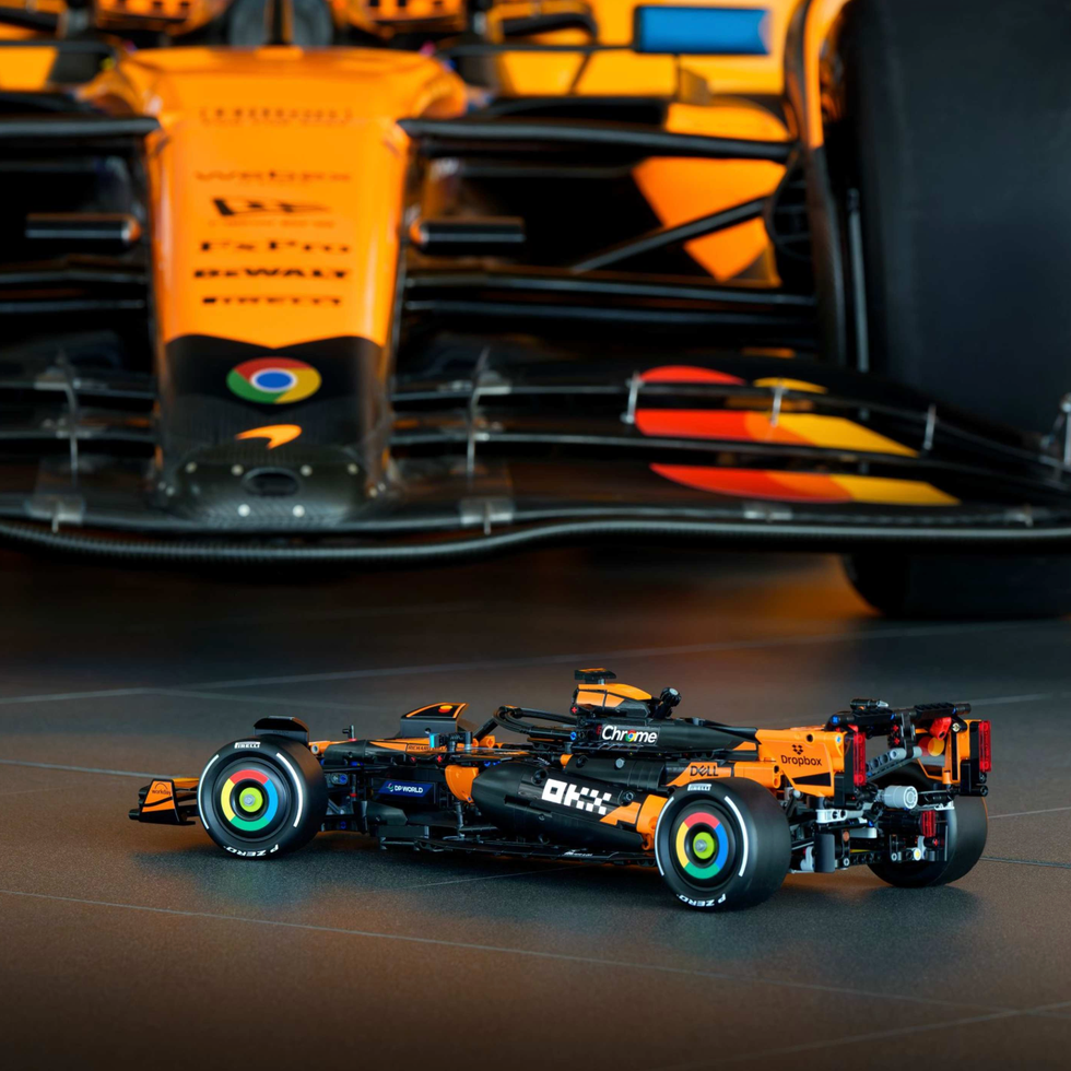 scale model of a formula 1 car positioned in front of a fullsized vehicle
