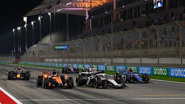 McLaren's Oscar Piastri, Cadillac's Sergio Perez, and Williams' Alex Albon practice launch procedures.