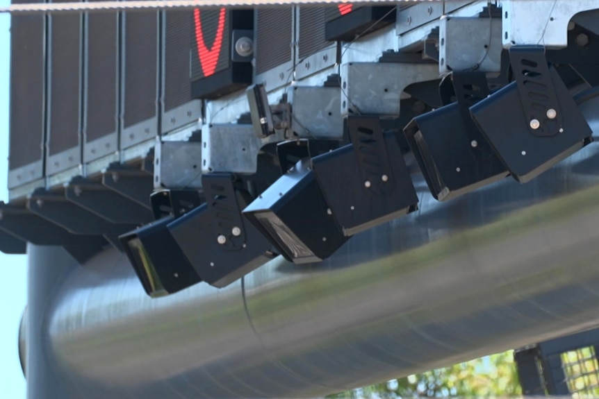 A row of cameras along a pole