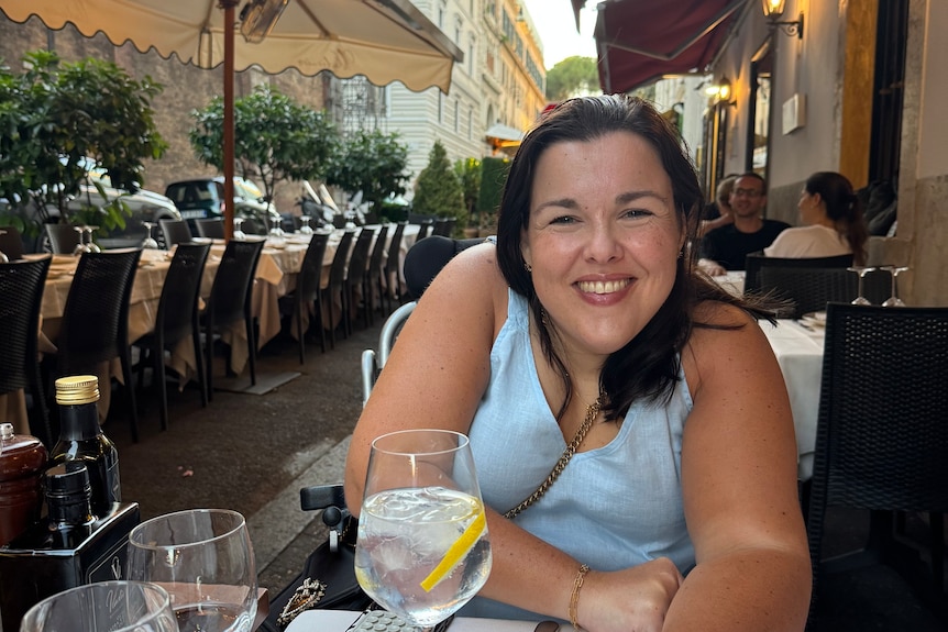 Peta Hooke sitting at a restaurant table smiling