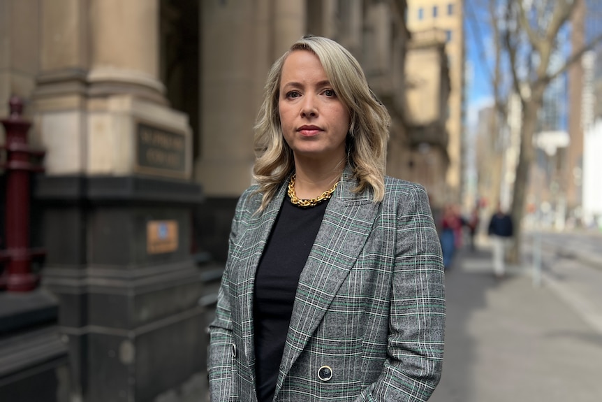 A woman in front of the VIctorian Supreme Court
