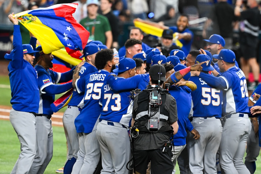Team Venezuela players celebrate after winning the 2026 World Baseball Classic final against the United States.