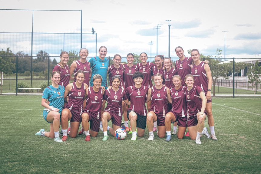 Iranian footballers pose with Brisbane Roar team after training.