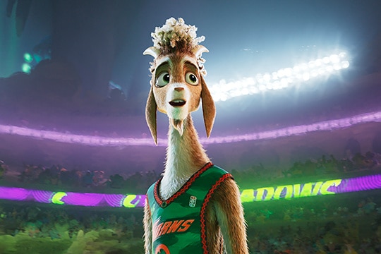 an animated goat wearing a basketball top and standing in a stadium