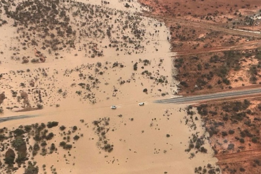 Aerial shot of a road leading underwater.