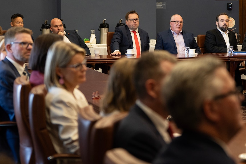 A group of Labor MPs sitting around a table