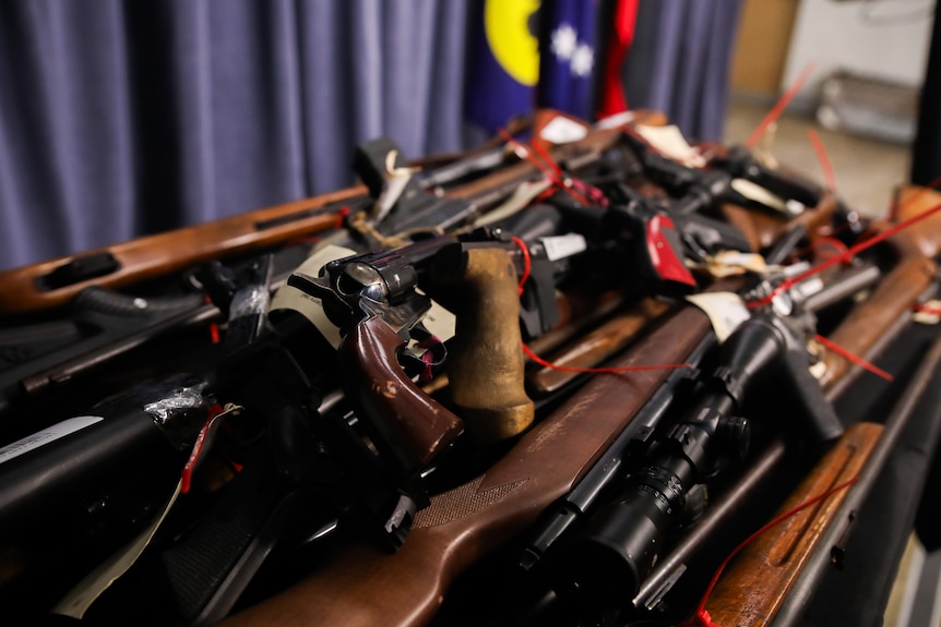 A collection of guns on display. 