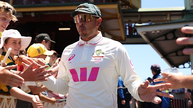 Usman Khawaja of Australia heads out onto the SCG for his final day of Test cricket.