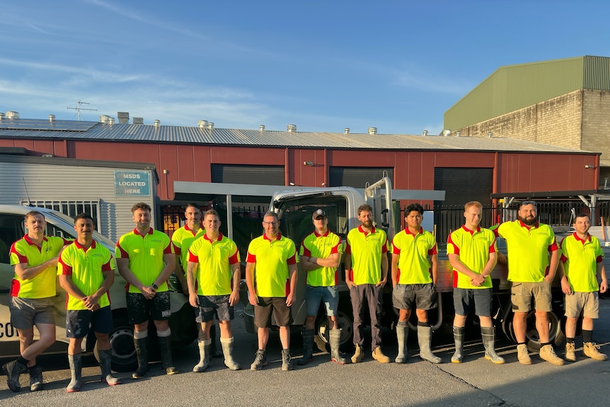Derick Brosnan and his team standing together for a photo