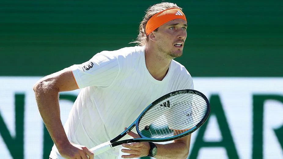 Alexander Zverev in white tennis shirt with orange headband