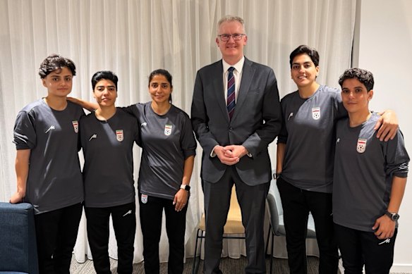 Minister for Home Affairs Tony Burke with five Iranian women soccer players who were granted asylum on Monday night. Some of the players have now left Australia.