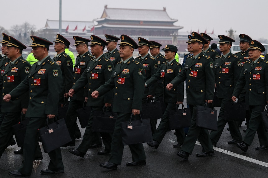 men march in uniform.