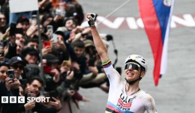 Tadej Pogacar celebrates winning the 2026 Strade Bianche