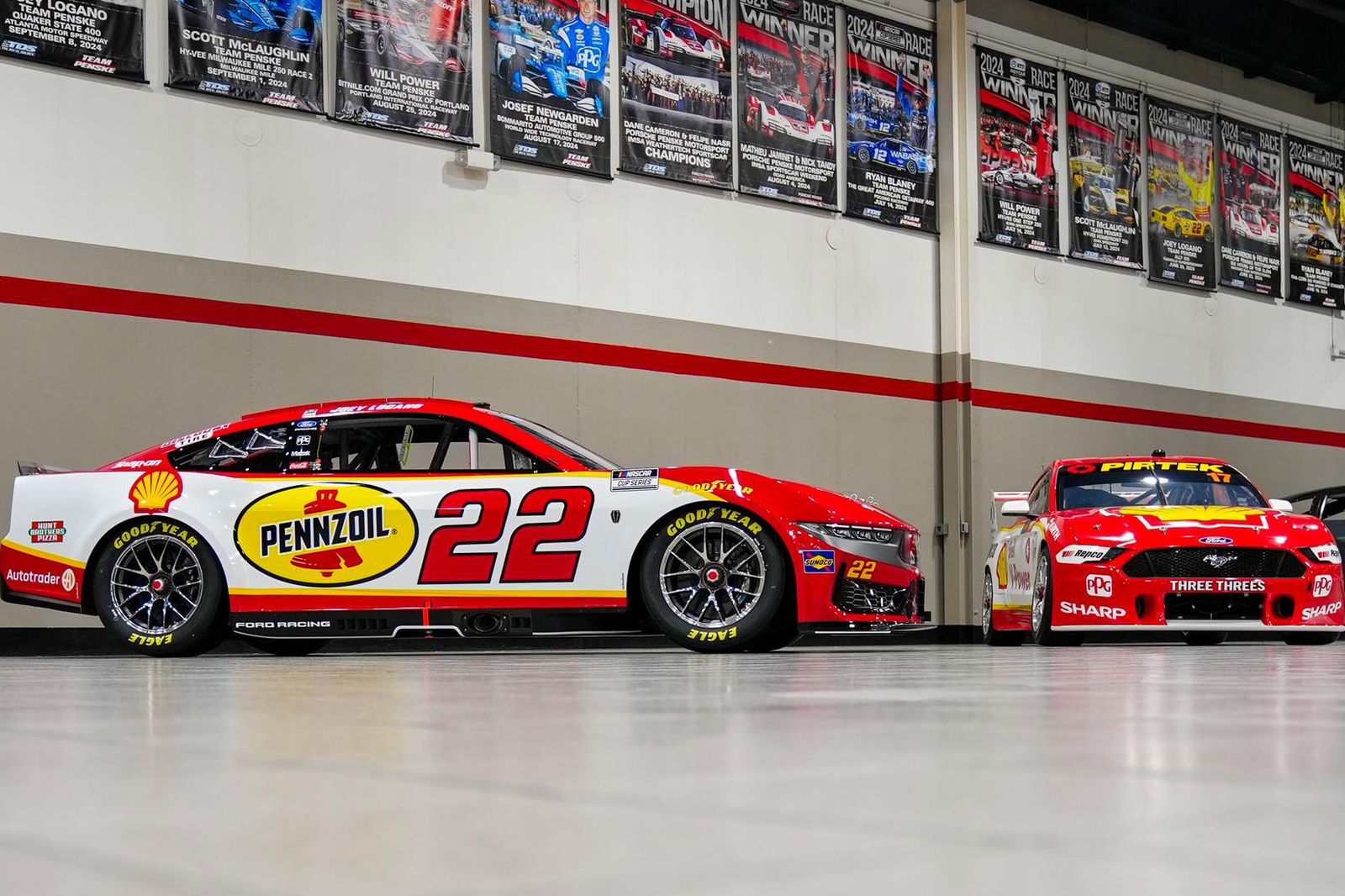 Scott McLaughlin's Bathurst 1000-winning Ford Mustang Supercar alongside Joey Logano's NASCAR Cup Series Ford Mustang stock car.
