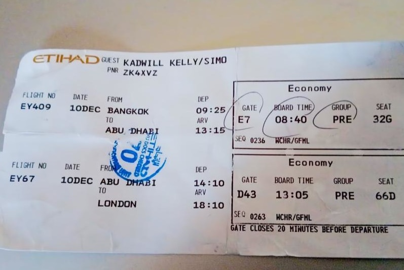 A plane ticket with Etihad at the top of the ticket. 