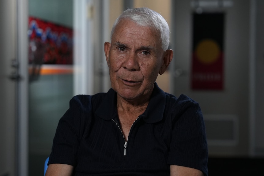 A man in a black shirt.