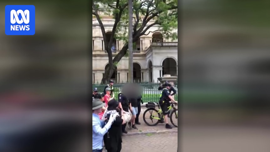 Protesters arrested for using phrases banned under new Queensland hate speech laws