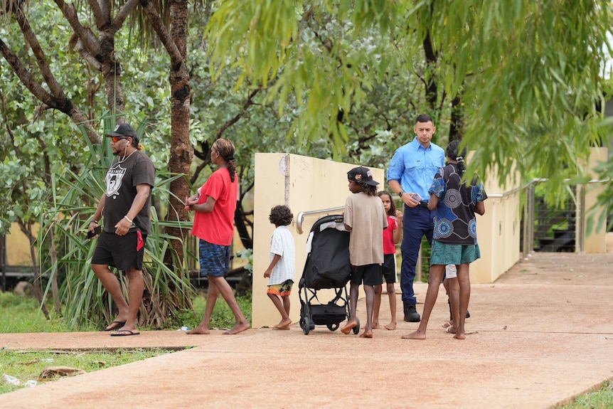 A government staffer directs families to support