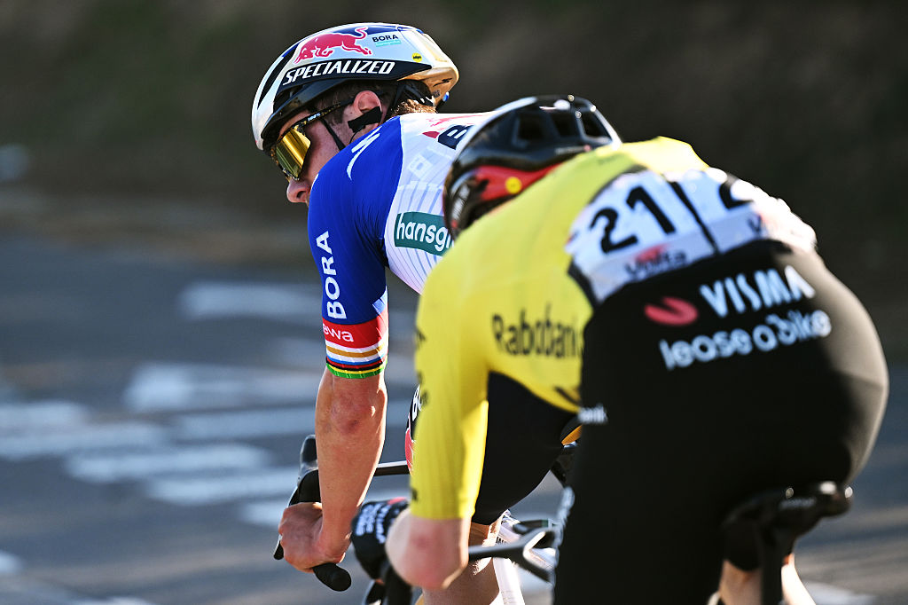 A close up view from behind as Vingegaard sits behind Remco Evenepoel during their breakaway