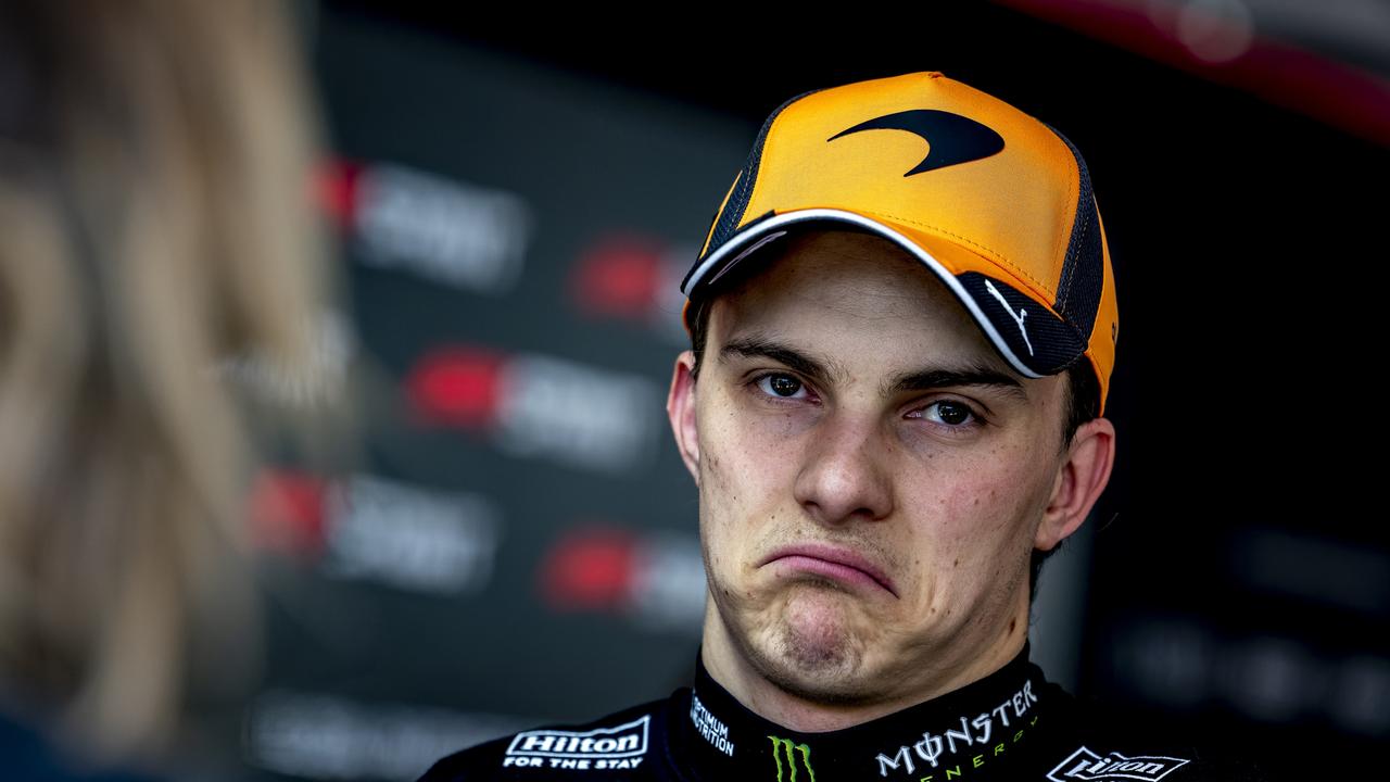 Mercedes' Austrian team principal and CEO Toto Wolff (L) congratulates third-placed Ferrari's British driver Lewis Hamilton