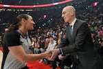 NBA commissioner Adam Silver greets NBA referee Ashley Moyer-Gleich as he arrives for an NBA basketball game between the Portland Trail Blazers and the Utah Jazz, Friday, March 13, 2026, in Portland, Ore.