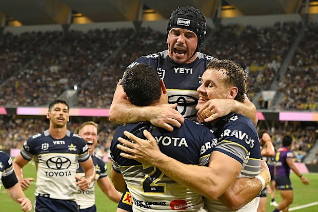 Braidon Burns celebrates after scoring a try.