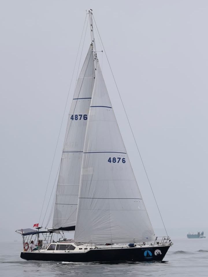 A yacht under full sail. 