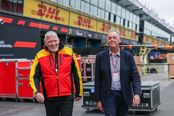 Simon Price (left), DHL motor sport event manager, with Phil Corcoran, managing director of DHL Australia & Papua New Guinea, in the pit lane at the Melbourne Grand Prix.