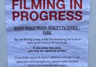New Bondi reality show sparks backlash after sign asks beachgoers who aren’t 'fit or attractive' to avoid camera range