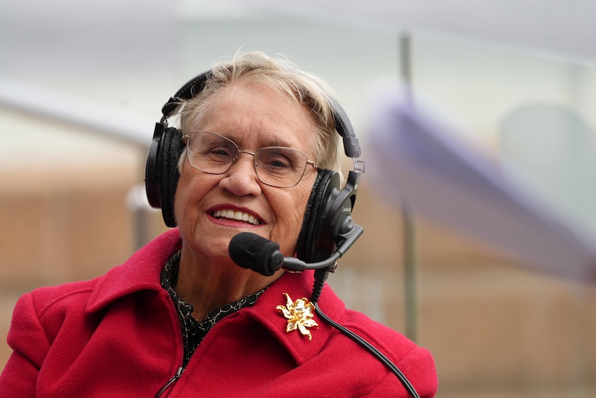 a woman in a red top 