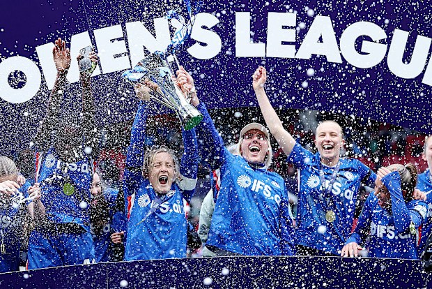 Chelsea's Millie Bright (centre right) and Erin Cuthbert (centre left) lift the trophy after winning the Subway Women's League Cup final.