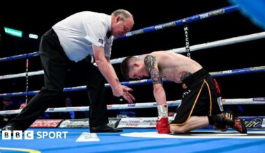 Phil Edwards counts a knocked down Lee Clayton during a boxing match