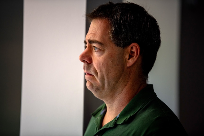 Simon Lewis is side profile headshot.