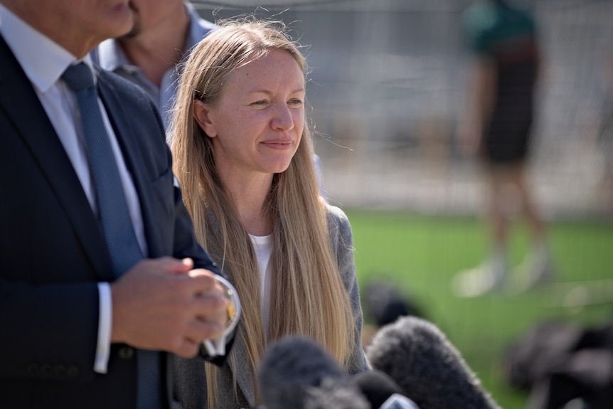 A woman talking at a press conference