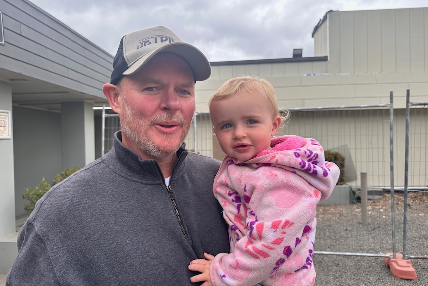 Man holding his daughter