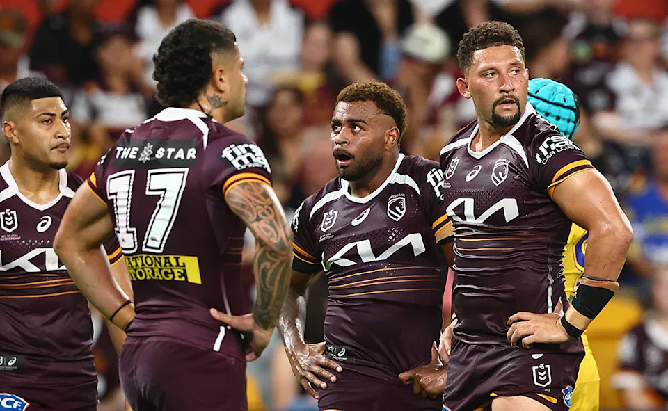 Ezra Mam and Gehamat Shibasaki with Broncos teammates.