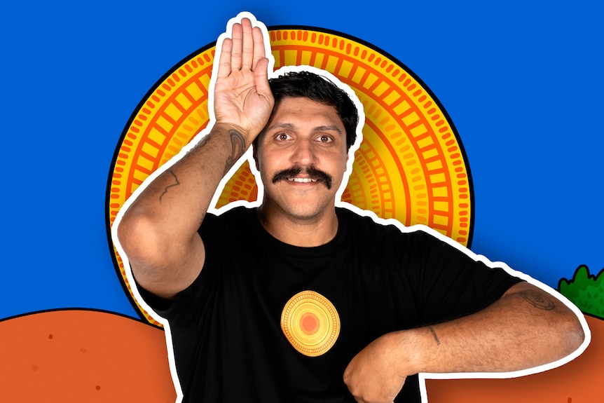 A smiling person poses with one hand up against the side of their face like an animal ear.