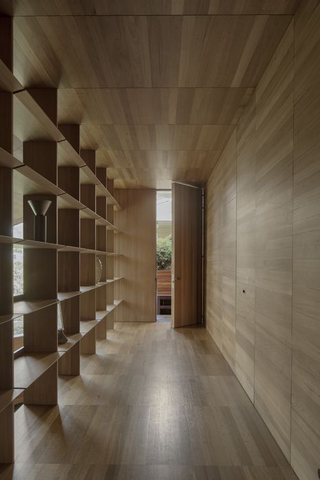 Joinery and linings align in a precise grid derived from a timber board’s width.