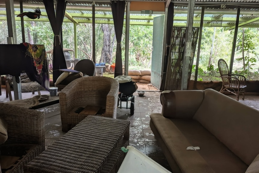 Possessions inside a flood-damaged home are discoloured and ruined from water.