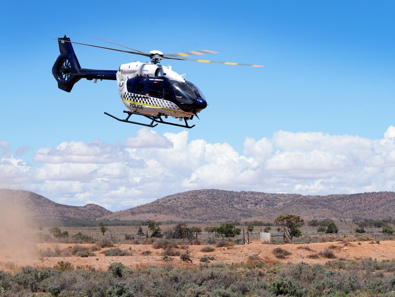 Taskforce Horizon officers searching on the northern perimeter of a conservation park near Oak Park Station. Picture: Dean Martin
