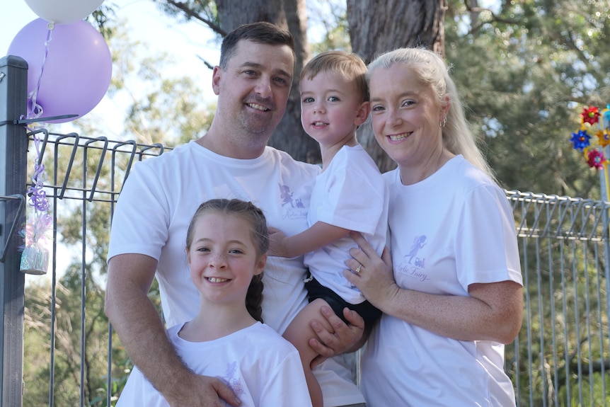 The family together holding each other.