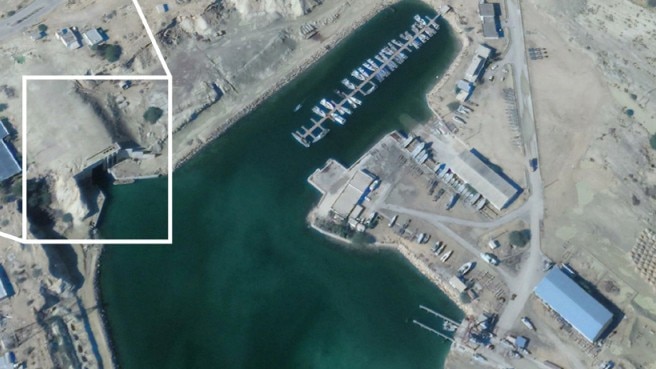 A satellite image of tunnel in the side of a cliff 