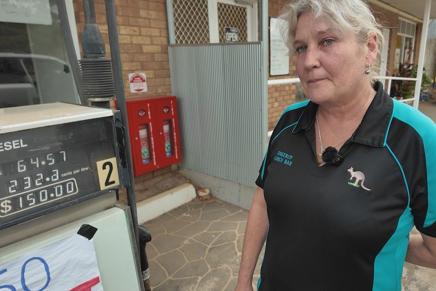 A woman on right side next to petrol bowser