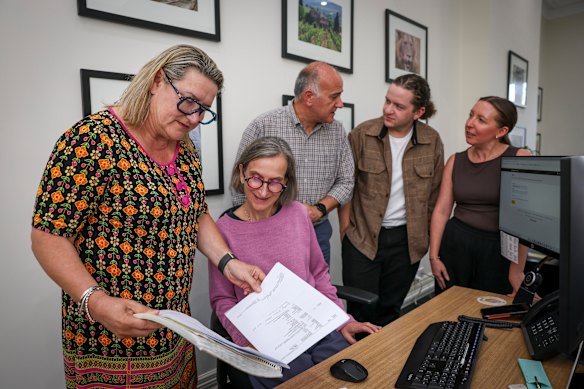 Travel agent Emma Whiting, left, pictured with her team, says travellers can still secure affordable flights to Europe if they are prepared to be flexible. 