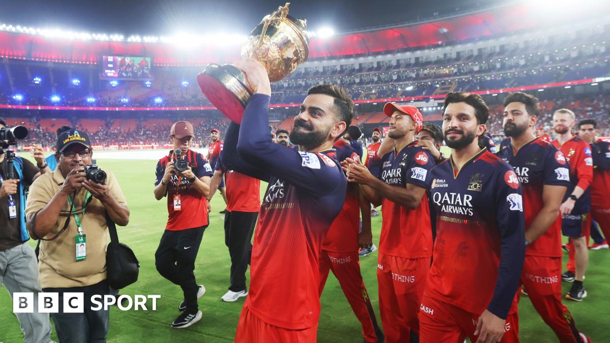 Virat Kohli and his RCB team-mates are photographed lifting the trophy