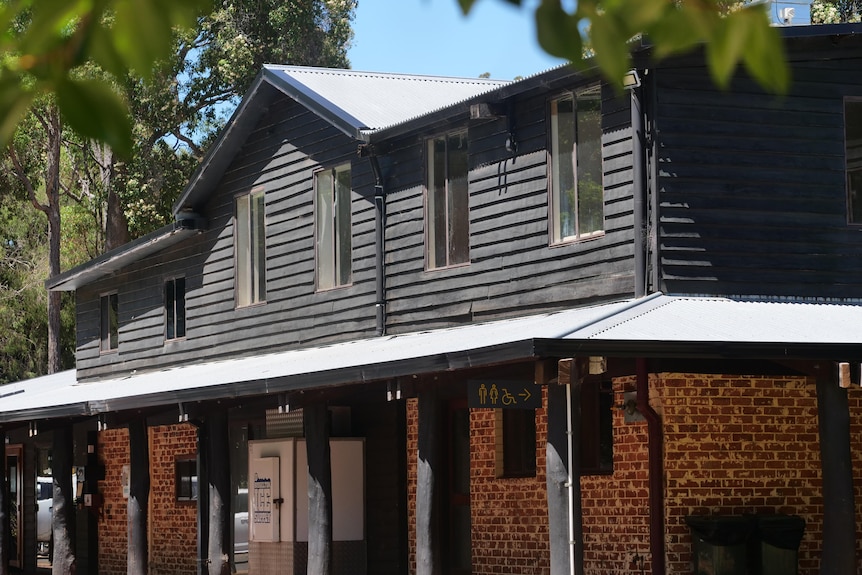 double storey building with brick on first floor and timber cladding on second floor